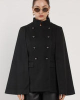 Black wool-blend military cape with a high neckline, double-breasted button front, and structured boxy silhouette.