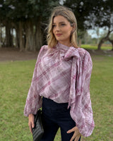 Orchid plaid pussybow blouse with long elasticated sleeves and a relaxed fit, worn with dark denim pants.