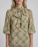 Sage green plaid pussybow blouse with elasticated puff sleeves and a relaxed, flared fit.