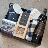 Campfire Boss Father's Day gift box with navy mugs, marshmallows, pistachios, tea towel, matches, and wine or lager