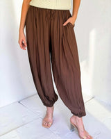 Frankie balloon-leg pants in rich chocolate featuring a relaxed fit, drawstring waist, and gathered elastic cuffs.