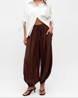 Chocolate brown balloon-style Frankie pants with an elastic drawstring waist, crafted from soft rayon-nylon fabric.