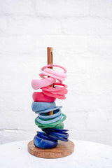 Assorted colorful handmade resin stacking cuffs by Greenwood Designs showcasing unique textures and stackable style