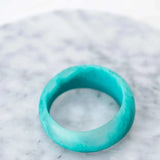 Greenwood Designs handmade resin stacking cuffs in assorted colors showcasing unique textured bracelet layers