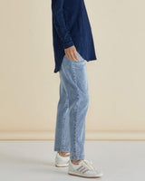 Side view of light-wash Haven straight leg jeans with a drop-crotch, elasticated waist, and functional pockets.
