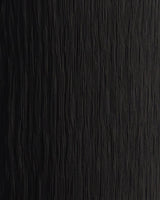 Close-up of black textured jersey fabric with vertical crinkled detailing for Heidi high-waisted pants.