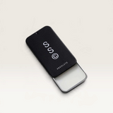 House of Holabox Solid State Absolute solid cologne in a sleek black sliding metal tin with white branding