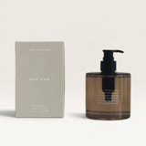 House of Holabox Addition Studio botanical hand wash in a brown glass bottle with pump next to its minimalist box.