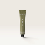 House of Holabox Addition Studio Peppermint lip balm in a green squeeze tube with minimalist white typography.