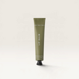 House of Holabox Addition Studio Peppermint lip balm in a minimalist olive green squeeze tube.