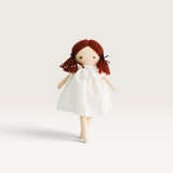 House of Holabox Alimrose Mini Matilda soft doll with red yarn hair and a white ruffled dress for imaginative play.