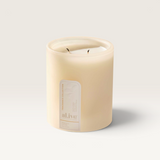 House of Holabox al.ive body Mango & Lychee soy candle in a frosted glass vessel with a gentle wisp of smoke
