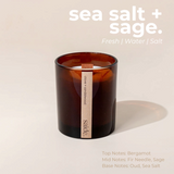 House of Holabox saide. amber glass soy candle with a wood wick and minimalist label on a neutral background.