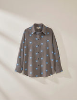 House of Holabox Athena Shirt: brown and white pinstripe cotton with blue eye-heart print, collared, button-front.