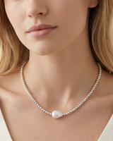 House of Holabox Izoa Amarae necklace featuring a white baroque freshwater pearl on a rhodium-plated textured bead chain.