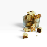 House of Holabox Proper Treats Co. Basque cheesecake bites in a ribbed glass bowl on a neutral background.