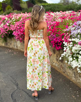 House of Holabox Beccy strapless maxi dress with pink floral print and sweetheart neckline in a garden setting