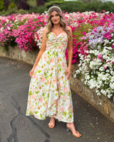 House of Holabox Beccy strapless maxi dress with pink floral print, sweetheart neckline, and gathered bodice detail.