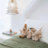 House of Holabox And the Little Dog Laughed Betty Hippo plush toy with party hat sitting on a white bed with friends