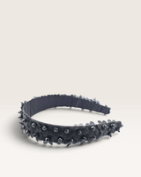 House of Holabox Izoa Rosalie black floral headband with dimensional fabric flowers and delicate pearl embellishments.