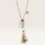 House of Holabox blush bunny necklace with a beaded tassel, metal rabbit charm, and colorful seed bead chain.