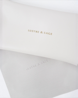House of Holabox white branded accessory case and matching grey fabric pouch with Lustre & Sage logo detailing