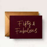 House of Holabox Fifty & Fabulous birthday card in deep burgundy with elegant gold foil lettering and matching envelope