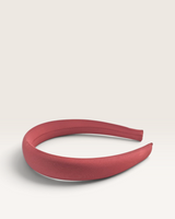 House of Holabox Izoa Hannah padded headband in a rich burgundy satin-like fabric with a rounded silhouette.