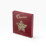 House of Holabox Chocolatier milk chocolate speckle in a festive red star-shaped window box with colourful sprinkles.