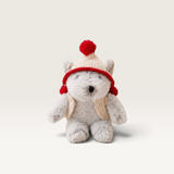 House of Holabox and the little dog laughed Christmas Alfred bear wearing a cream merino wool vest and hat with red pom