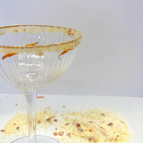 House of Holabox The Peel Thing Citrus Pash cocktail sugar rim on a ribbed glass with dried orange and flower petals