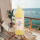 House of Holabox Margarita Margarita classic citrus margarita mix in a 1L bottle on a tropical balcony by the ocean