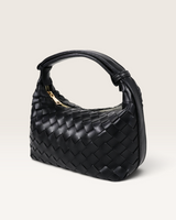 House of Holabox Cleo black woven vegan leather handbag with an adjustable top handle and gold-tone zipper.