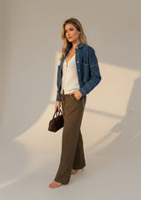 House of Holabox Cleo Denim Cropped Jacket in dark blue, made of cotton denim, with a relaxed fit and button front.
