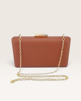 House of Holabox Izoa Bianca structured cocoa brown PU leather clutch with a gold-tone clasp and detachable chain strap.