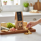 House of Holabox Port Willunga Fine Foods dried pears on a grazing board with cheese, grapes, and prosciutto.
