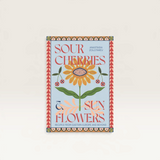 House of Holabox Sour Cherries and Sunflowers cookbook featuring a vibrant floral illustration on a light blue cover.