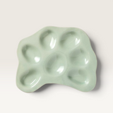 House of Holabox Ecology Selvedge stoneware oyster plate in Mine green with a glossy reactive glaze finish.