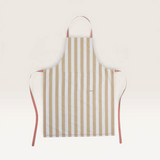 House of Holabox Ecology Porto Lola apron in almond featuring vertical stripes and contrasting pink ties