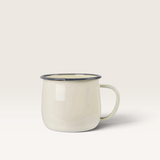 House of Holabox pink and white enamel belly mug with a rustic design and 375ml capacity for hot beverages.