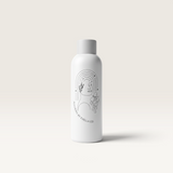 House of Holabox Evella.Co Alluring foaming bath bubbles in a white bottle with minimalist line art illustration.