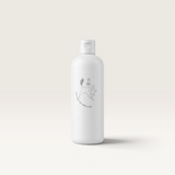 House of Holabox Evella.Co Mystique foaming bath bubbles in a white bottle with minimalist line art label design.