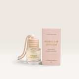 House of Holabox Soaked Body Bar Japanese Honeysuckle floral car diffuser with wooden lid and hanging rope next to box