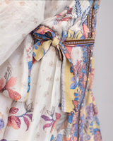 House of Holabox Sara Mini Event Dress in cotton featuring a yellow floral print with blush, lilac, and blue accents.