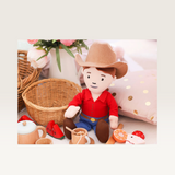 House of Holabox George the Farmer plush doll wearing a red shirt, blue jeans, and a brown felt cowboy hat