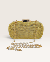 House of Holabox Izoa Helen gold rope-wrapped clutch bag with a gold clasp and detachable chain strap.