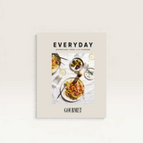 House of Holabox Gourmet Traveller Everyday cookbook featuring a cover photo of pasta and olives on a white cloth.