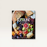 House of Holabox Graze Platter Book featuring a vibrant charcuterie and fruit spread on the cover