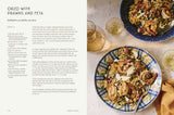 House of Holabox Greek Odysea cookbook page featuring a recipe for orzo with prawns and feta on a blue patterned cloth