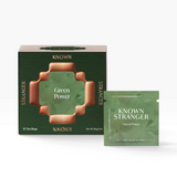 House of Holabox Known Stranger Green Power tea box and individual sachet with green packaging and copper accents